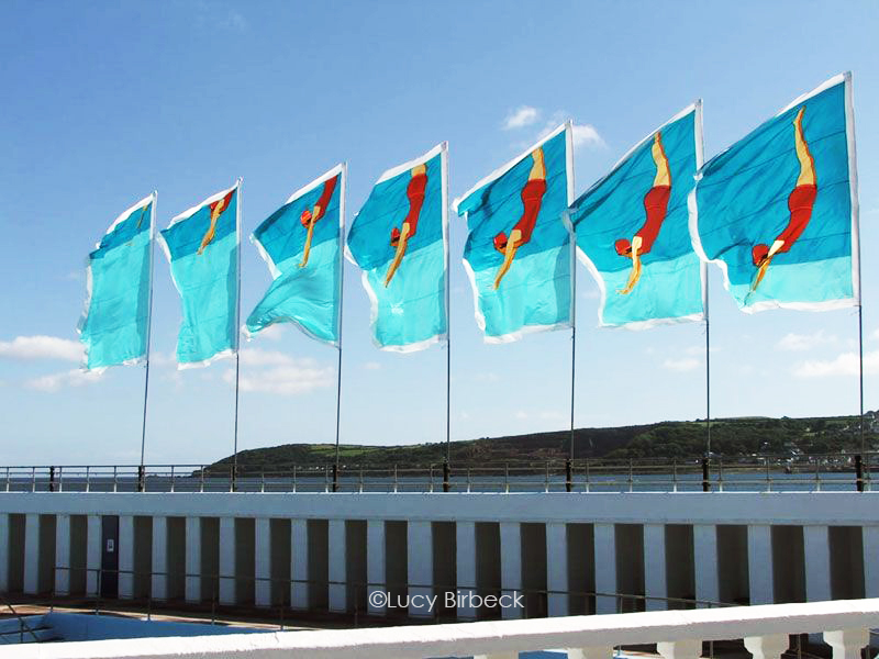 Lucy Birbeck's 'Diver' flags at Jubilee Pool on Penzance Promenade, Cornwall UK